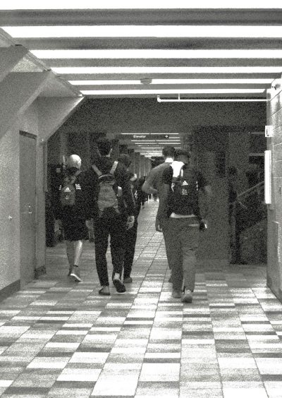 Athletes walk the halls of the Centre for Kinesiology, Health & Sport at the University of Regina.
