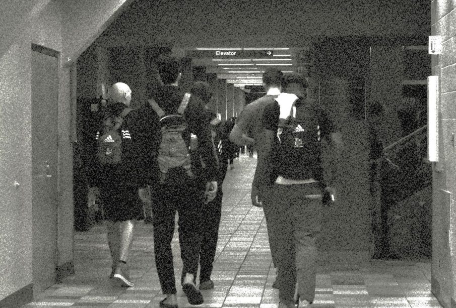 Athletes walk the halls of the Centre for Kinesiology, Health & Sport at the University of Regina.