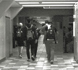 Athletes walk the halls of the Centre for Kinesiology, Health & Sport at the University of Regina.