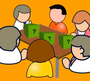 A group of people sit around a table with three boxes on the table surface and a question mark on each box.