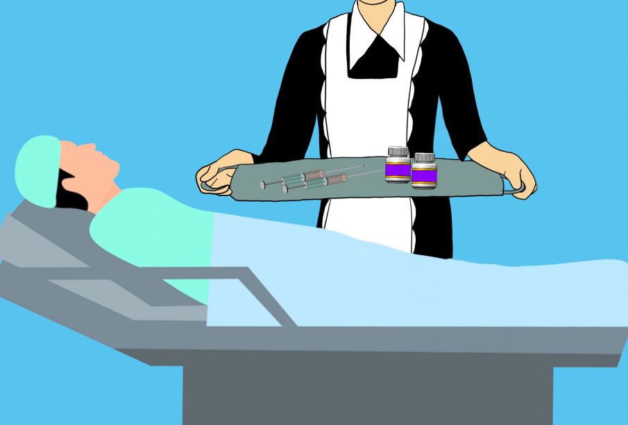 A traditional looking maid in black uniform stands beside a hospital bed and patient holding a serving tray of syringes and drugs.