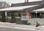 A photo of Regina Lutheran Home’s front entrance from the sidewalk across from the building. 