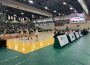 A photo of the University of Regina and Fraser Valley’s women’s basketball teams playing a match. The players are focused on the basketball in the air. The score is 33:25 in Fraser Valley’s favour.