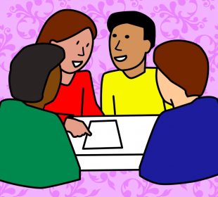 Four friends sitting around a table, talking. They all look like they are from different parts of the world.