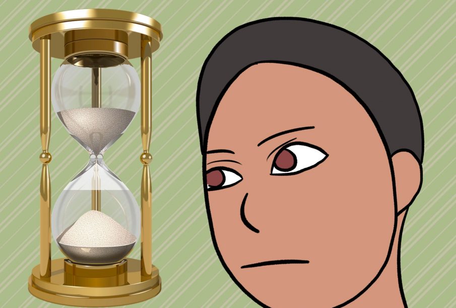 A person staring at an hourglass.
