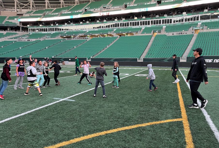 Two Ehrlo Sport Venture youth football teams playing in Mosaic Stadium.