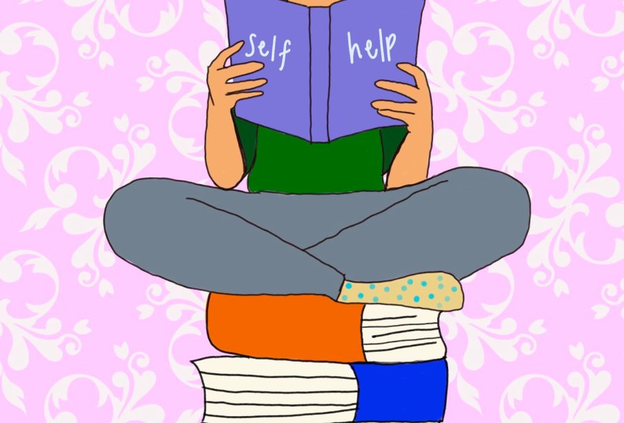 A person reading a self-help book, sitting on top of a pile of other books