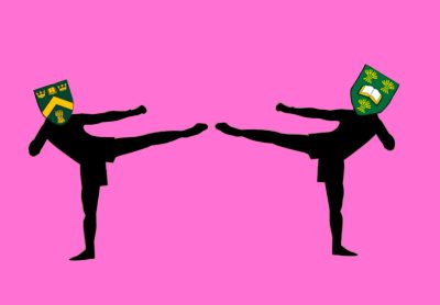 Two silhouette outlines of people have their legs raised, kicking toward each other. The figure on the left has the U of R’s logo in place of a head, and the figure on the right wears the U of S logo.