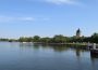 A shot of Wascana Lake, with the still waters of the lake and the Legislative Building visible at a distance.