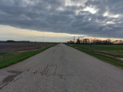 A photo of a Saskatchewan highway leading into the horizon.