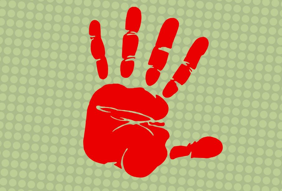 A red left handprint on a grey textured surface.