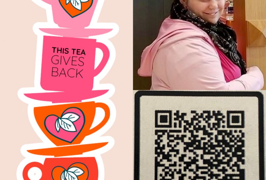 There is a stack of tea cups and plates beside an image of a person. On the left side there are four pink and orange tea cups stacked with their tea plates between them. There are triple leaf designs on three of the tea cups, while the second from the top has “This Tea Gives Back” written on it. The person to the write of the image is wearing black leggings, a light pink sweater, and a hot pink shirt along with a black purse and a black and white patterned scarf. They are smiling to the left of the camera and grabbing a water from a shelf that is behind their head and to their left.