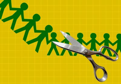 A yellow background with a green chain of paper-cutouts in the shape of people holding hands with stainless-steel scissors in the foreground.